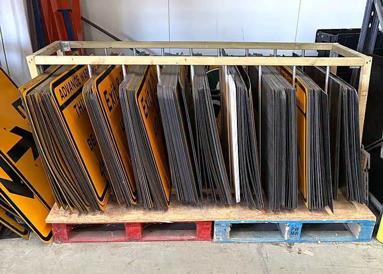 A rack of event road signs stored ready for use