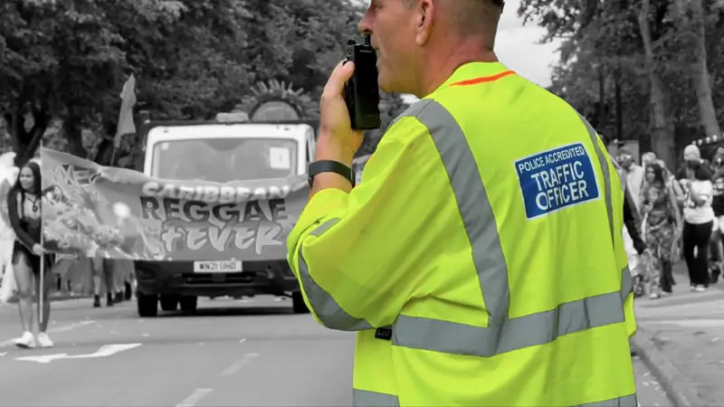 A police-accredited EST traffic officer using a radio