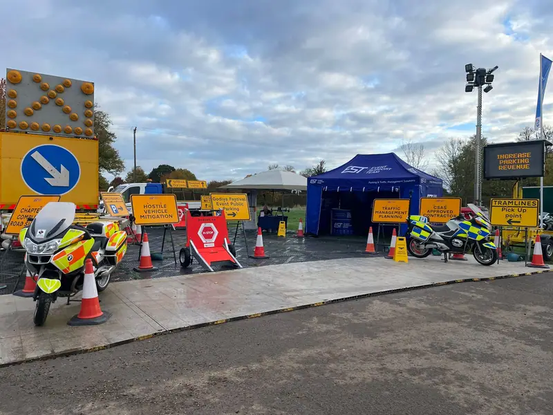 The EST stand at The Showman’s Show with event signs, a message board and police motorcycles