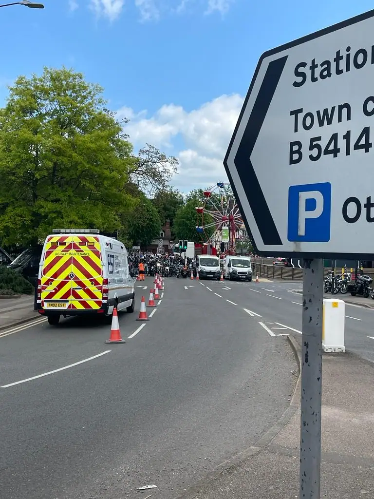 Event signage and a highway maintenance vehicle on a managed road